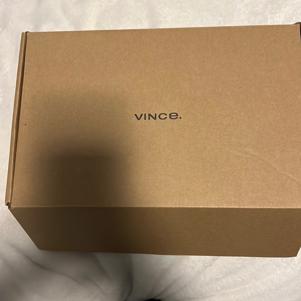 White perforated leather Vince slip ons